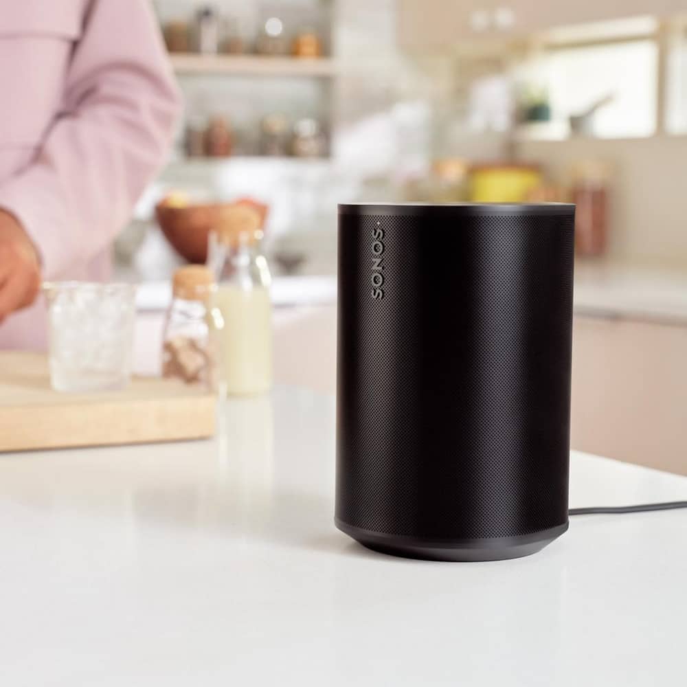 A black Era 100 speaker on the kitchen counter top for immersive sound while cooking